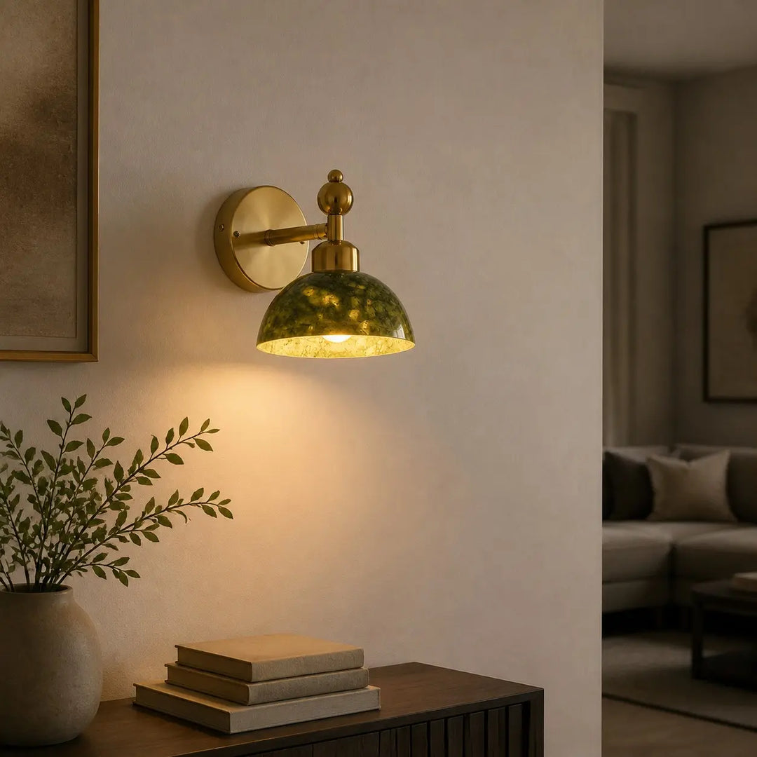 Green stone wall light casting warm ambient light