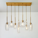 Load image into Gallery viewer, Lumivelle Sculptural 7-Light Chandelier – Adjustable Height Modern Glass Pendant
