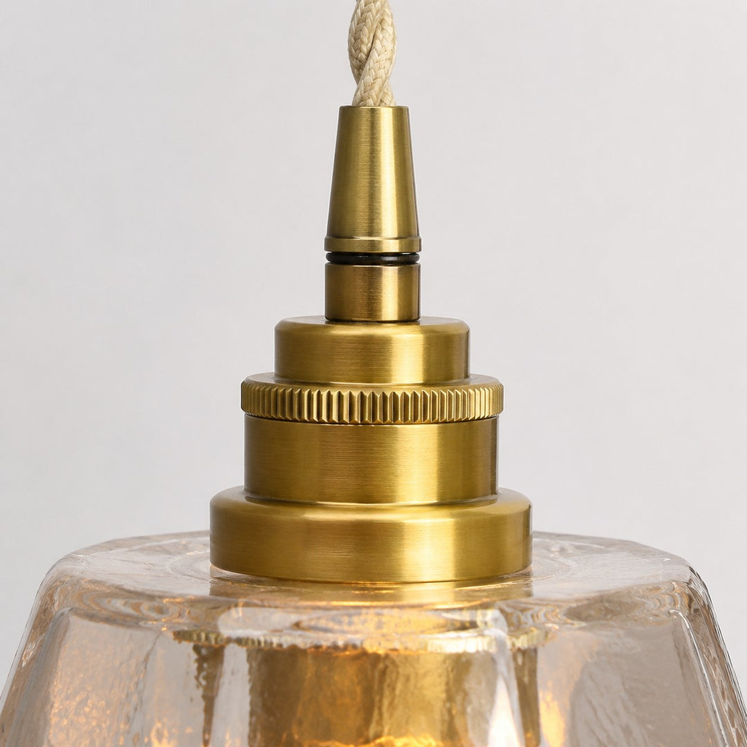 Antique brass lamp holder close-up on faceted glass shade