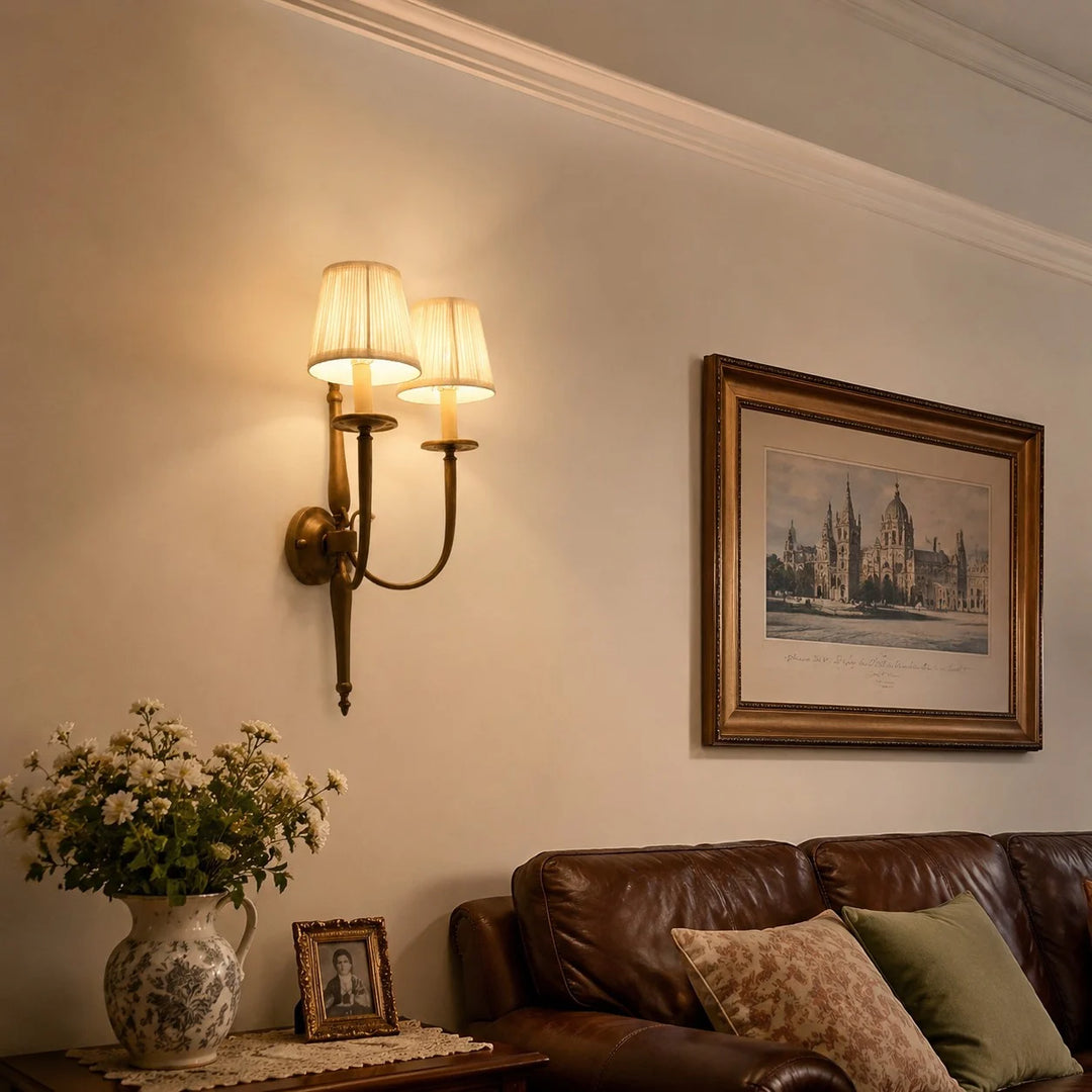 Antique brass wall sconce in a classic living room