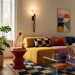 Bild in Gallery-Viewer laden, Tall amber glass wall sconce in a colorful living room