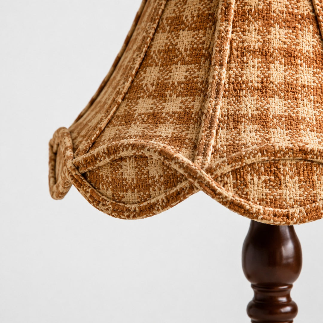 Close view of the patterned fabric shade and scalloped trim