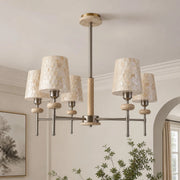 Five-light shell mosaic chandelier installed in a refined living room