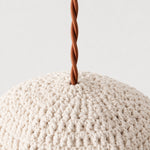 Charger l'image dans la visionneuse de galerie, Close-up of twisted brown pendant cord entering the ivory handwoven shade