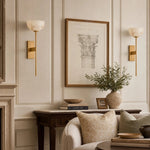Cargar imagen en el visor de la Galería, Natural brass wall sconces beside framed art
