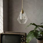 Cargar imagen en el visor de la Galería, Faceted glass pendant light hanging near a vintage television and plant