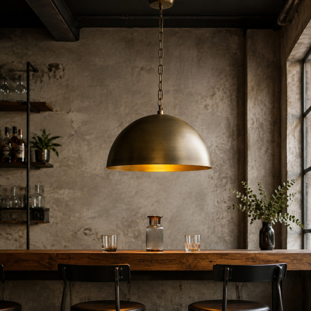 Large aged matte brass dome pendant light with warm inner finish