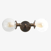 Lumio Globe Clear Glass Wall Sconce – Modern Industrial Wall Light for Vanity & Hallway