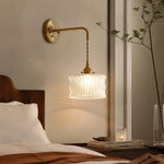 Cargar imagen en el visor de la Galería, White ripple glass wall sconce mounted above a bedside table