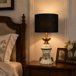 Load image into Gallery viewer, Gold motif ceramic table lamp on a bedside table