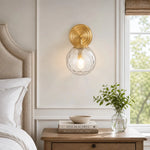 Load image into Gallery viewer, Pair of gold and rippled glass wall lamps in a bedroom