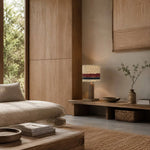 Cargar imagen en el visor de la Galería, Striped loofah table lamp lit in a natural wood interior