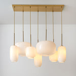 Load image into Gallery viewer, Lumivelle Sculptural 7-Light Chandelier – Adjustable Height Modern Glass Pendant
