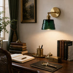 Load image into Gallery viewer, Green brass glass wall sconce above a writing desk