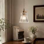 Cargar imagen en el visor de la Galería, Style M ornate clear glass pendant beside books and tableware