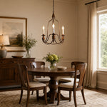 Load image into Gallery viewer, Antique bronze three-light candle chandelier in a warm dining room