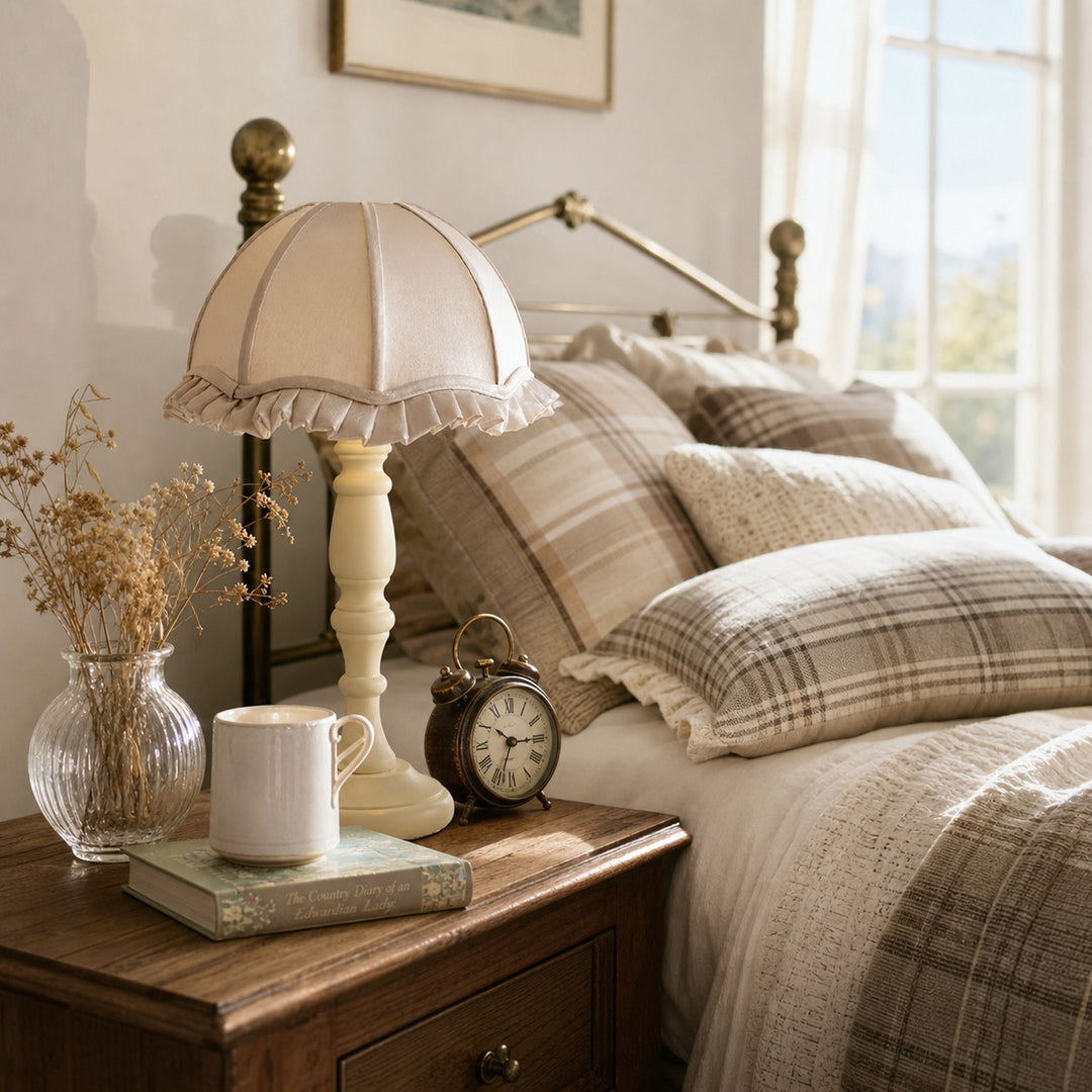 Fabric shade table lamp styled on a bedside table