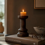 Load image into Gallery viewer, Solid wood candle holder styled on books in a warm interior; candle not included