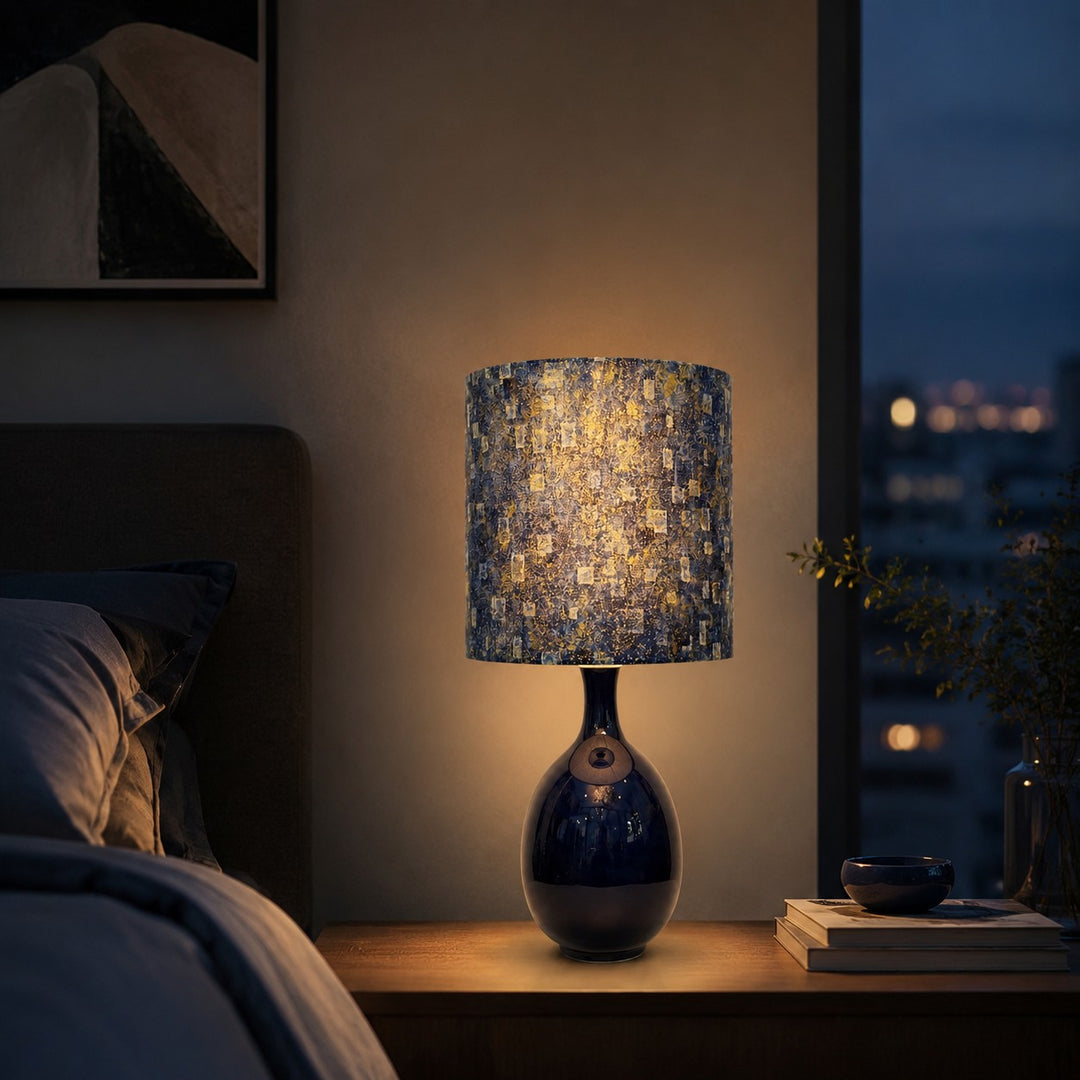 Blue gold patterned table lamp in a warm bedroom setting
