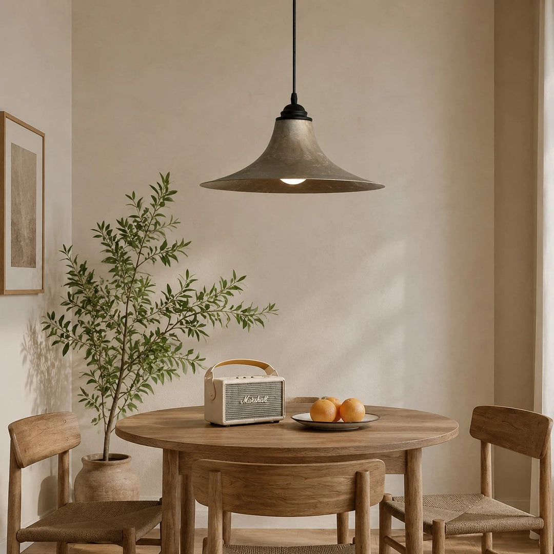 Black iron pendant lamp in a styled dining nook