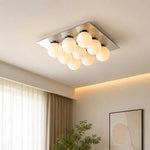 Cargar imagen en el visor de la Galería, Main gallery image: chrome square ceiling light installed in a warm living room, lights on.