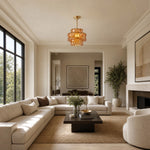 Load image into Gallery viewer, Amber glass pendant in a bright neutral living room