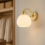 Load image into Gallery viewer, Milk glass flower wall lamp in an elegant dressing area