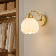 Milk glass flower wall lamp in an elegant dressing area