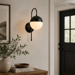 Bild in Gallery-Viewer laden, Black milk glass wall lamp in a hallway