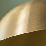 Load image into Gallery viewer, Close-up of the brushed brass finish on the copper dome shade