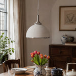 Load image into Gallery viewer, White ribbed pendant light over a dining table with tulips