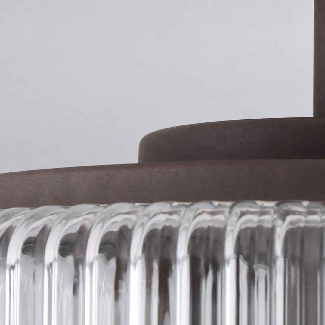 Close-up of metal canopy and ribbed glass edge