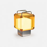 Rechargeable table lamp with translucent acrylic panels and a brushed metal base