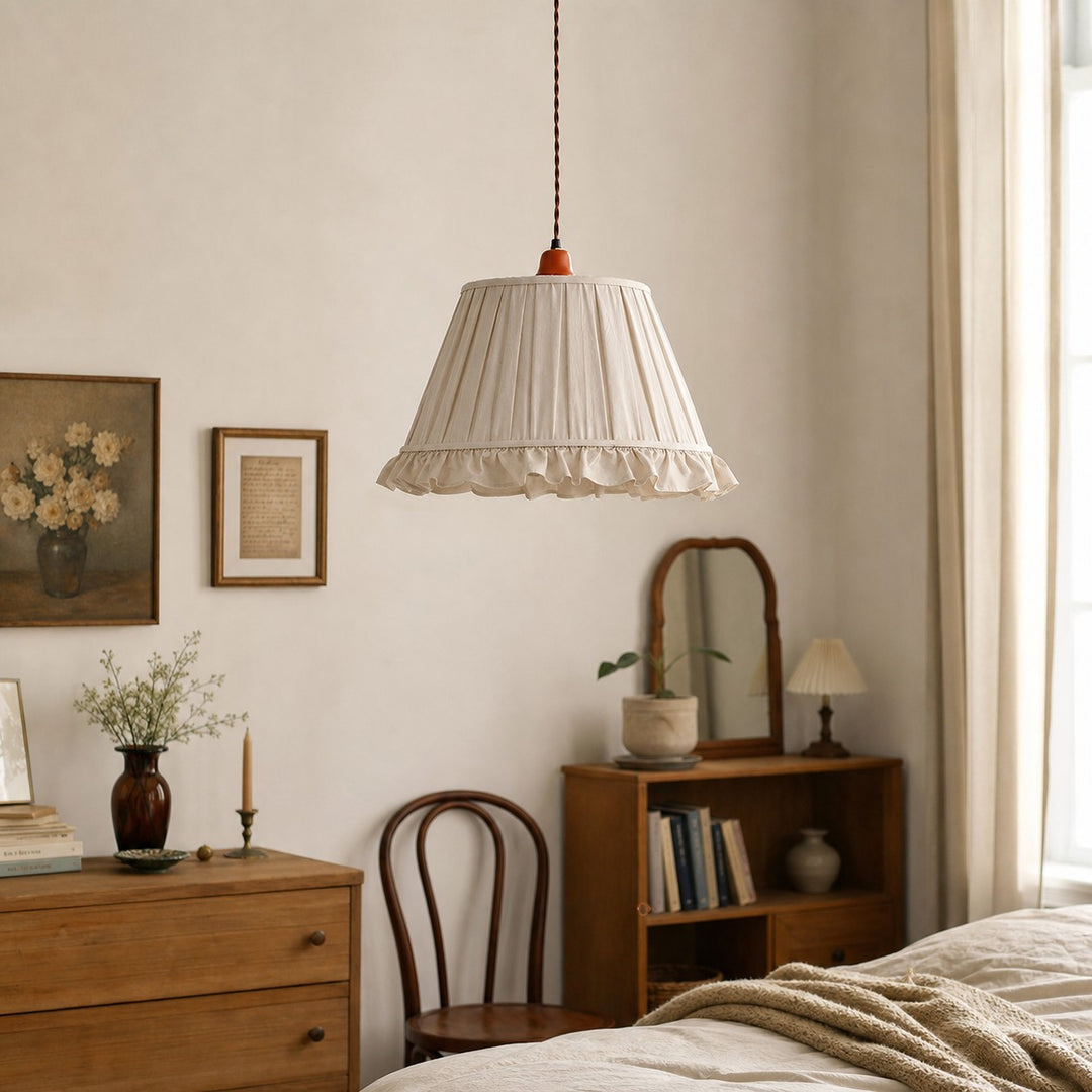 Pleated pendant light in a warm bedroom corner