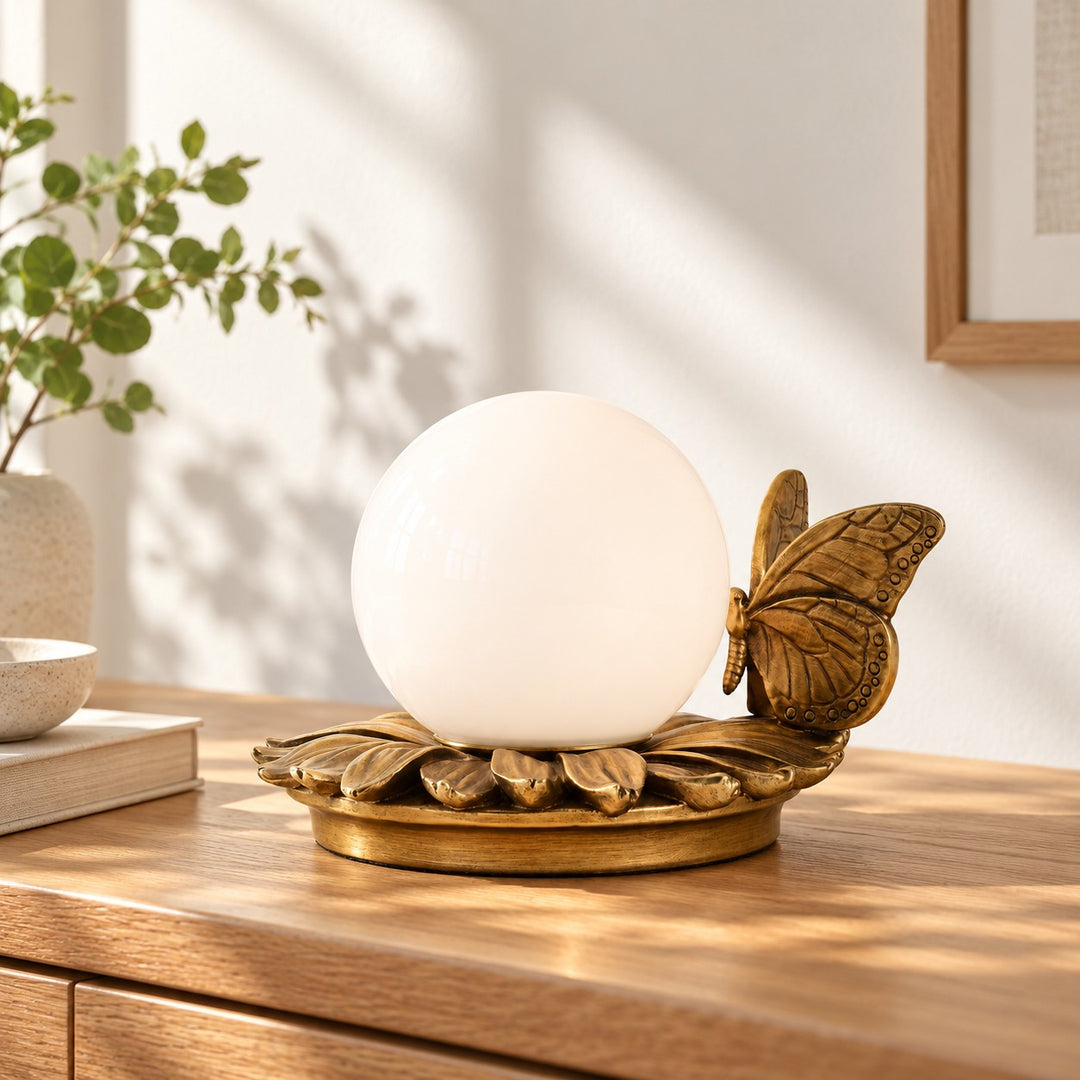 Round Globe Perched Motif Brass Resin Table Lamp