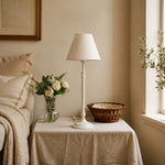 Load image into Gallery viewer, Ivory French country table lamp in a bright sitting area