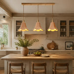 Load image into Gallery viewer, Natural triple pendant above a kitchen island