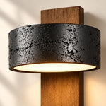 Load image into Gallery viewer, Close view of the pitted black travertine shade against walnut