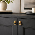 Cargar imagen en el visor de la Galería, Brass ring pulls on a dark cabinet