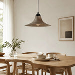 Load image into Gallery viewer, Aged black iron pendant lamp over a dining table