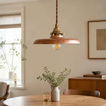 Load image into Gallery viewer, Distressed gold pendant light above a dining table