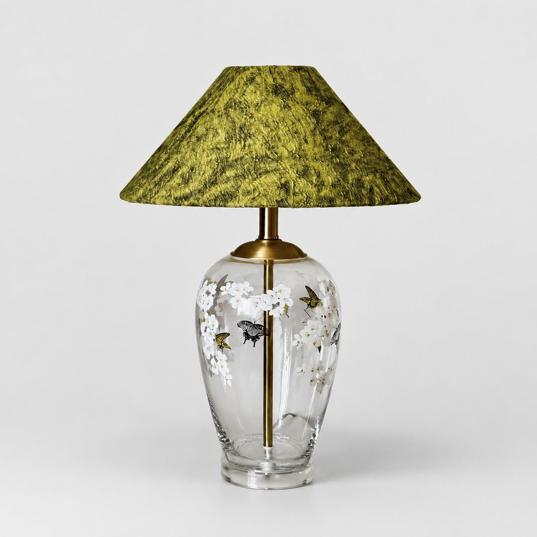 Floral glass table lamp with green textured fabric shade front view
