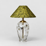 Floral glass table lamp with green textured fabric shade front view