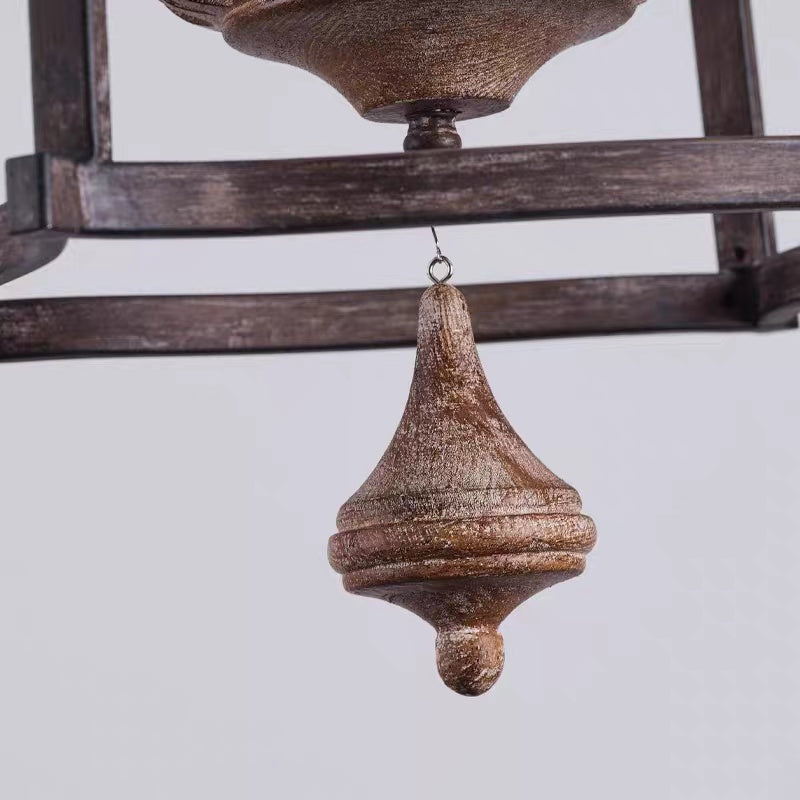 Lower finial and hanging accent detail of rustic birdcage pendant lamp