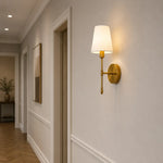 Cargar imagen en el visor de la Galería, Vintage brass wall light installed in a European-style interior