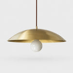 Load image into Gallery viewer, Brushed brass-finish dome pendant light on a neutral background