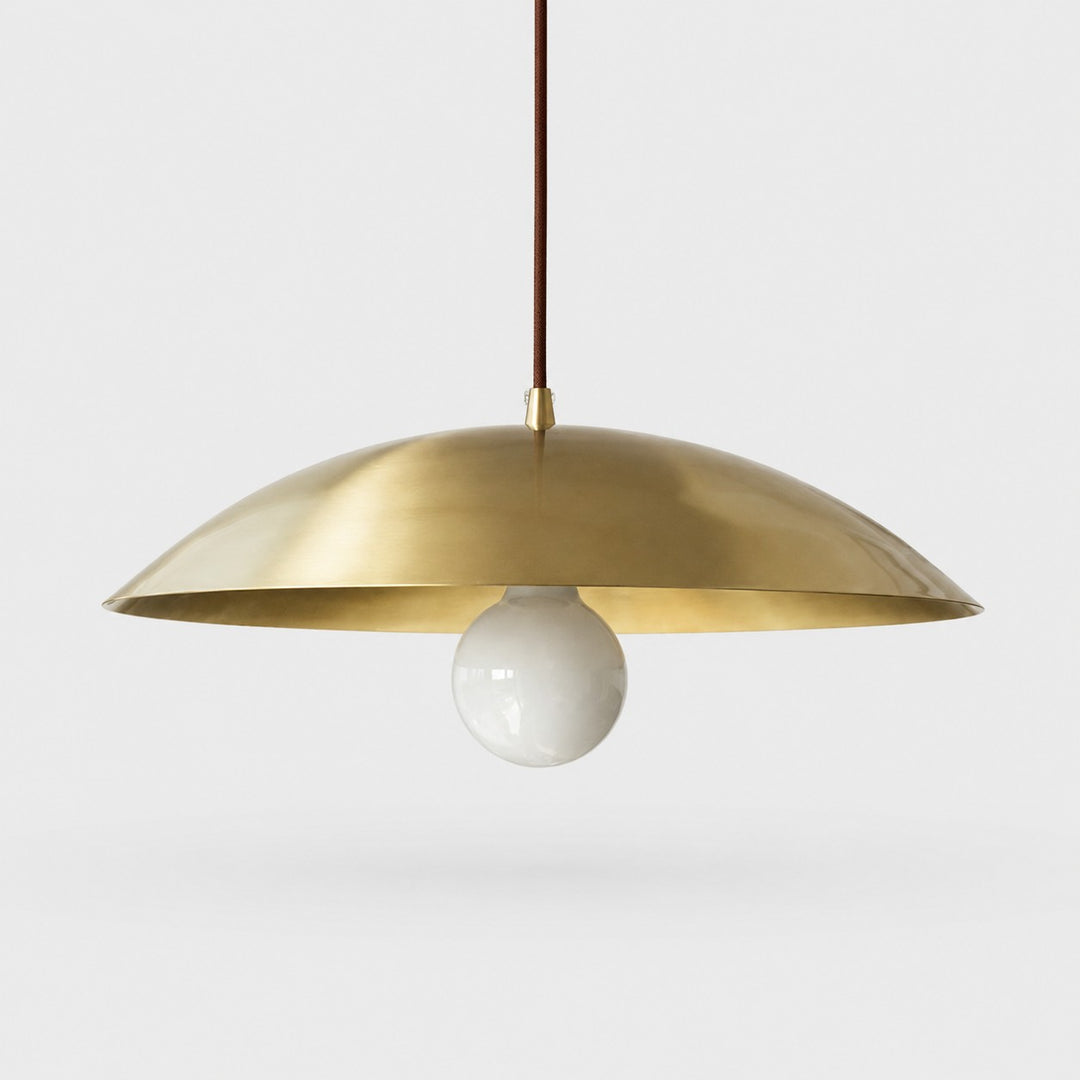 Brushed brass-finish dome pendant light on a neutral background