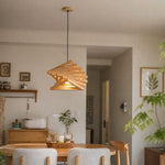 Load image into Gallery viewer, Natural wood pendant light above dining table