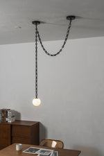 Load image into Gallery viewer, Black Metal Alabaster Globe Hardwired Chandelier