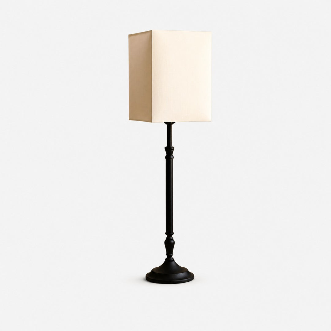 Square fabric shade table lamp on a clean background